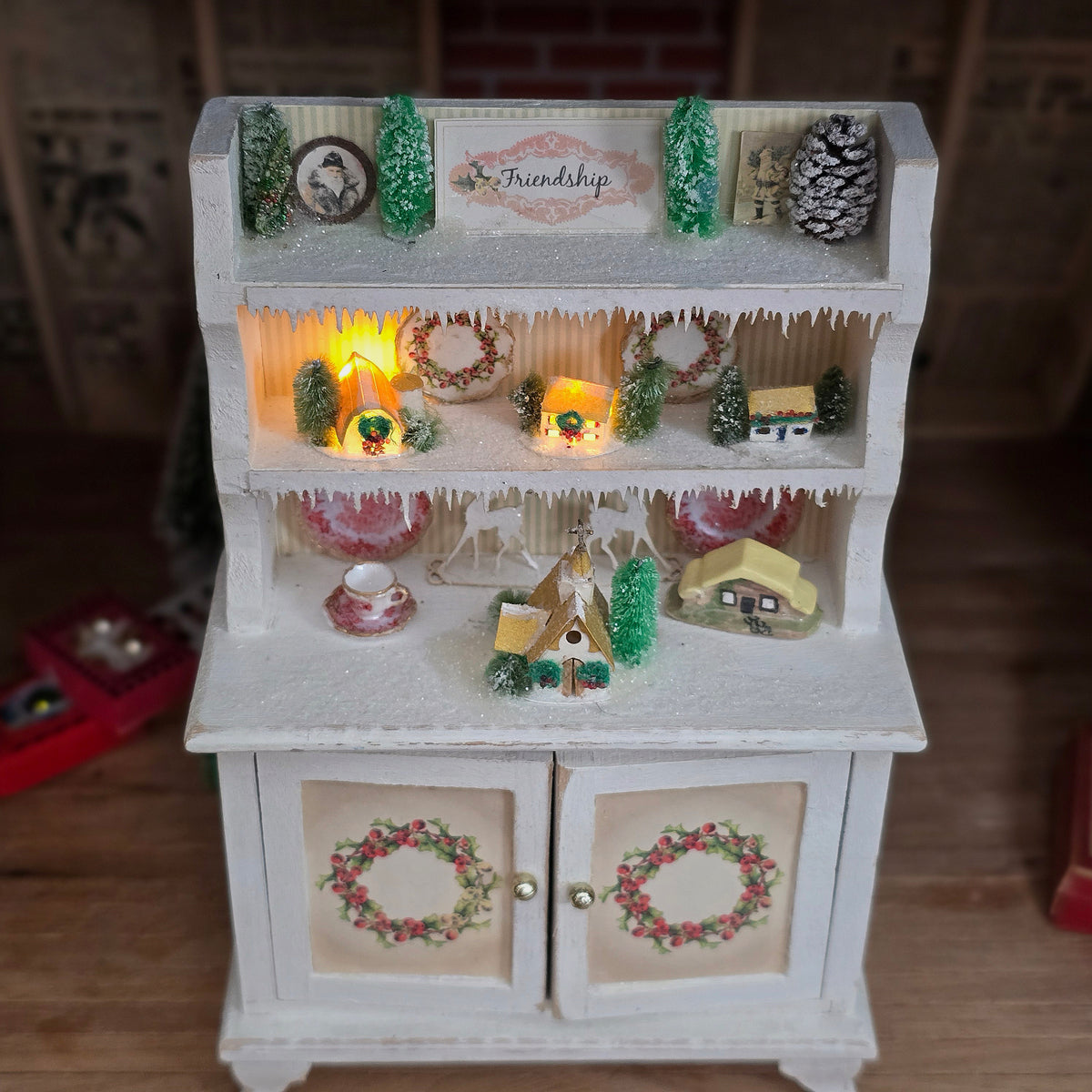 Artisan Lighted Christmas Village Hutch with Frosted Trees, Wreaths & Holiday Décor