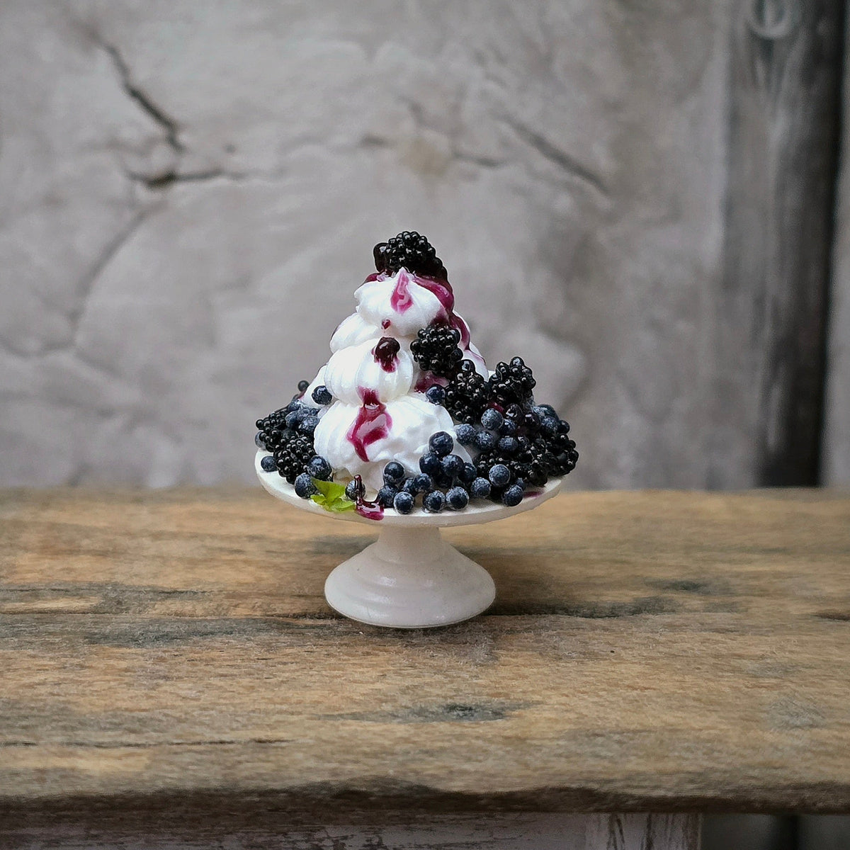 Gosia Suchodolska Miniature Blackberry & Blueberry Pavlova on White Porcelain Stand