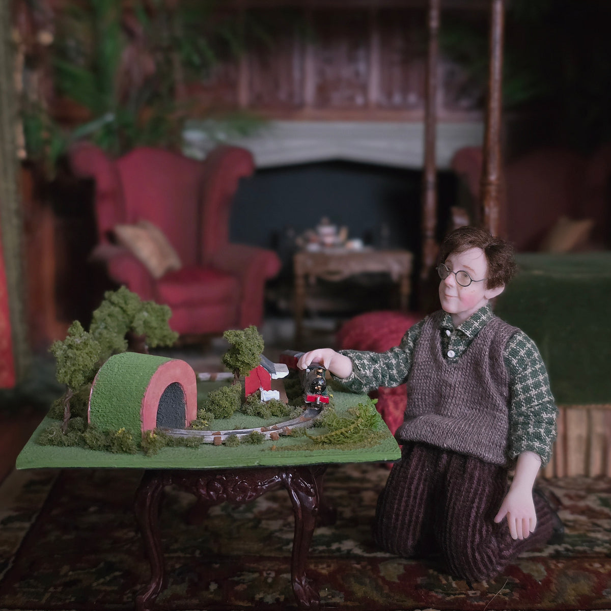 1:12 Scale Young Boy Playing with Train Set by Julie Campbell Miniature Vignette