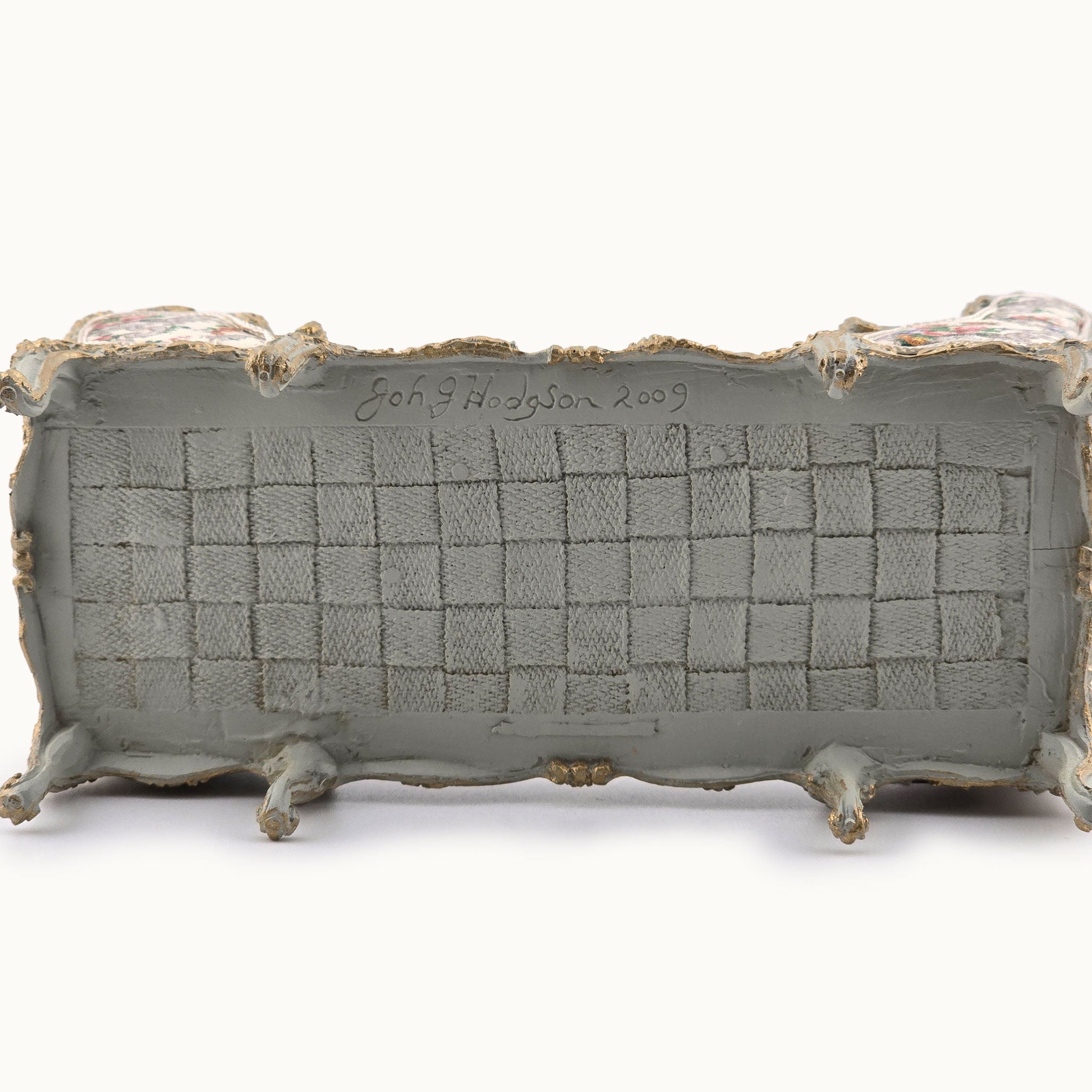 Underside of chaise with John J. Hodgson signature on a white background, dated 2009