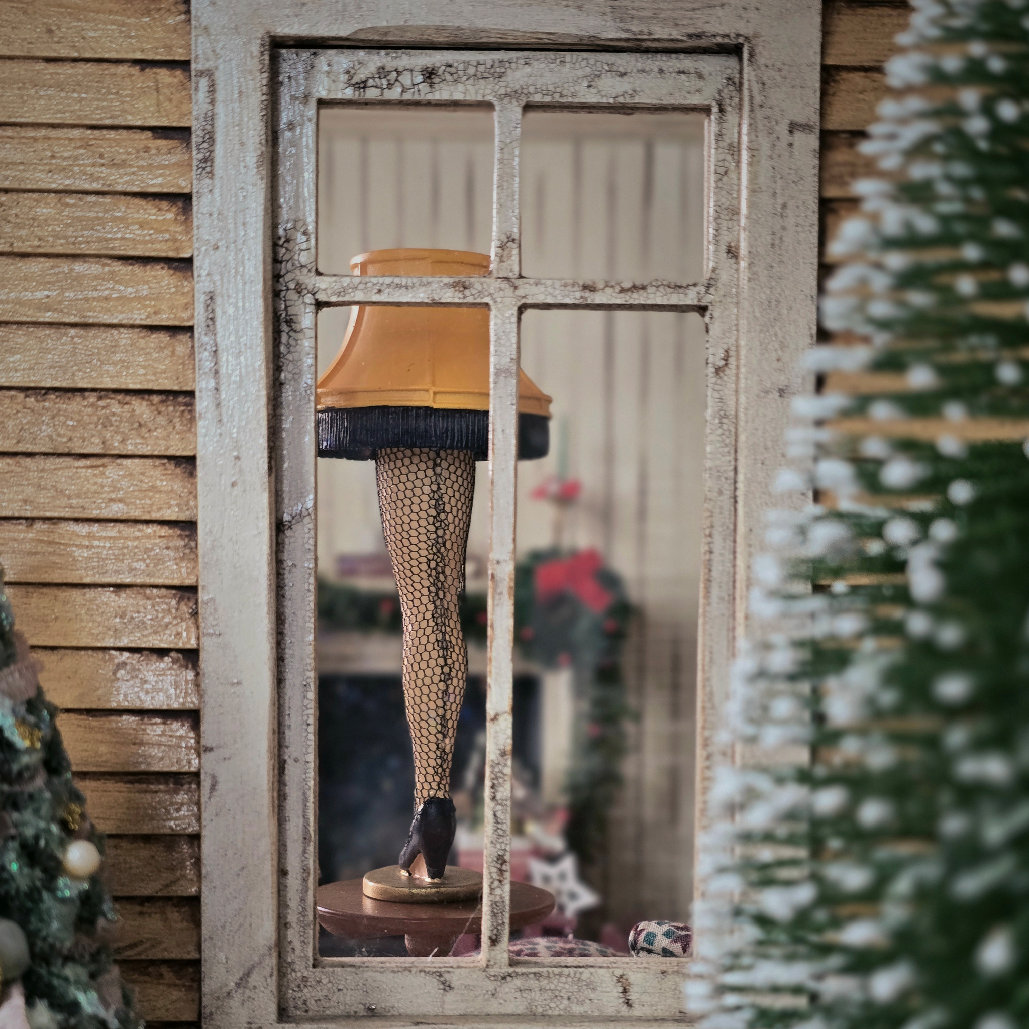 Miniature Leg Lamp – A Christmas Story Replica, back view, as seen through a window