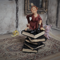 Load image into Gallery viewer, 1:24 Scale Older Beggar Woman Clay Figure OOAK Handmade Miniature on Stack of Books
