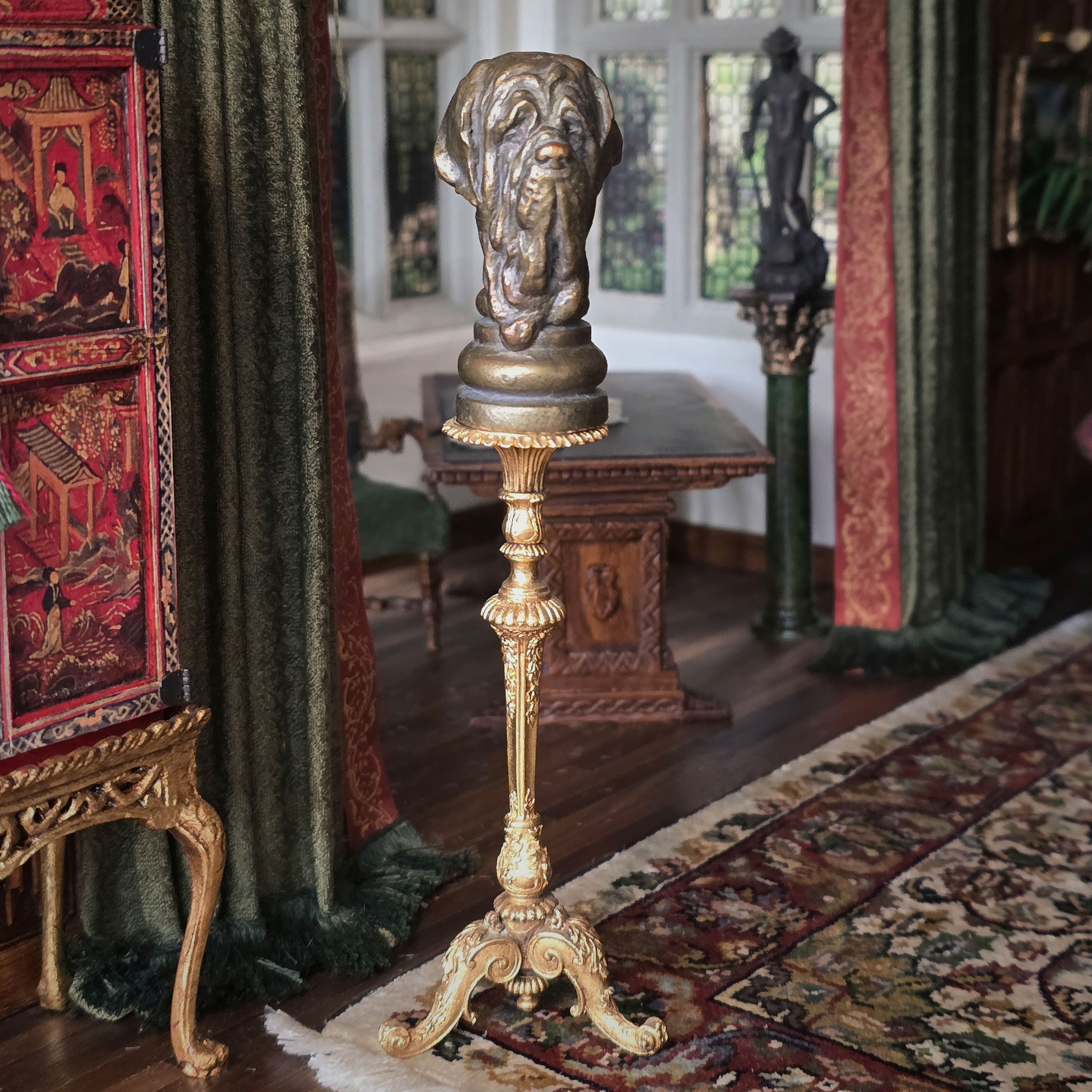 Decorative stand with a dog sculpture in an ornate room