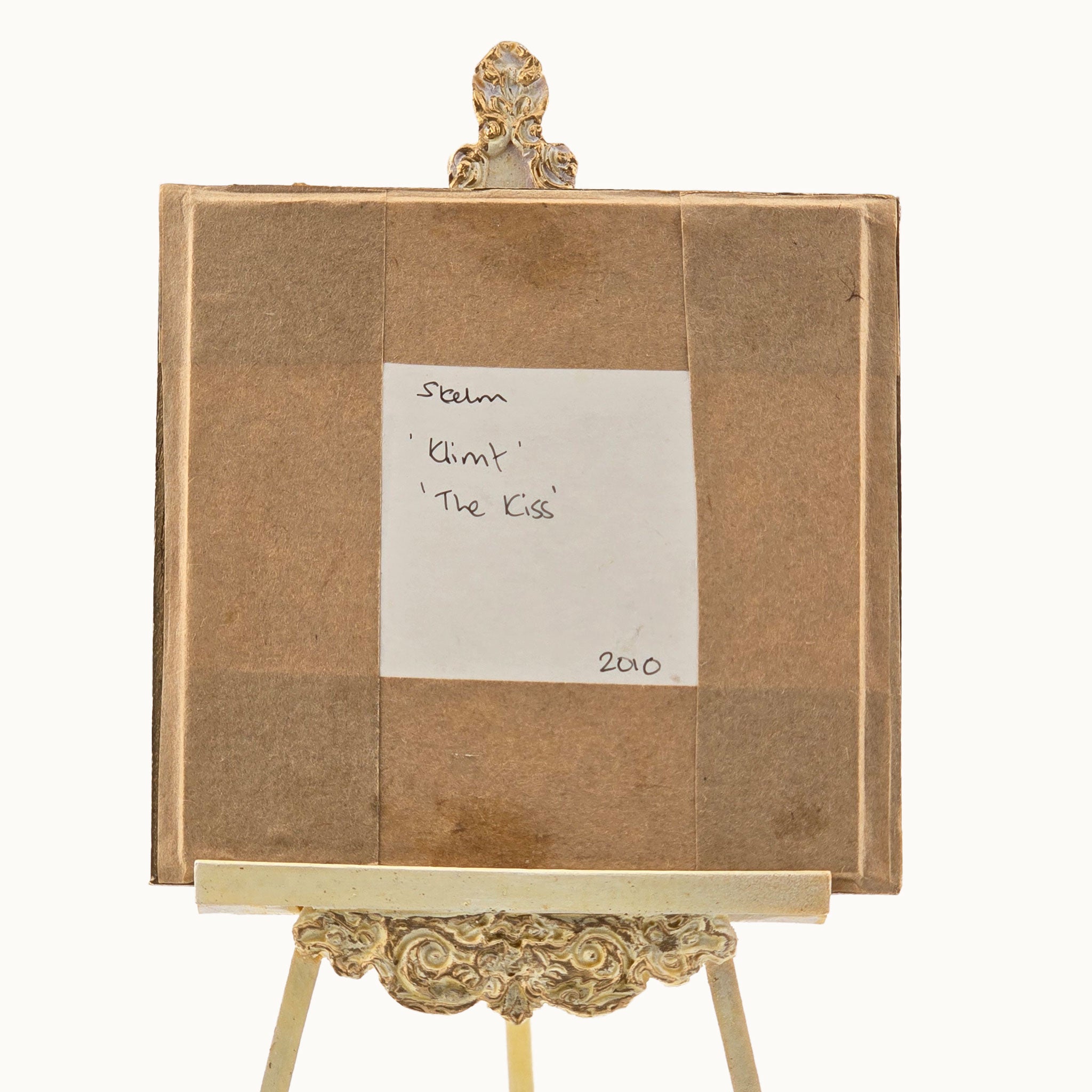 Decorative easel with the backside of the painted, signed by Sam Kelm, dated 2010