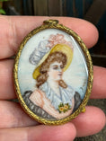 Load image into Gallery viewer, Antique Oval Framed Dollhouse Painted Portrait of Lady on Porcelain, in hand
