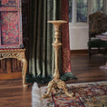 Load image into Gallery viewer, Decorative gold candlestand in an ornate room with a rug and curtains.
