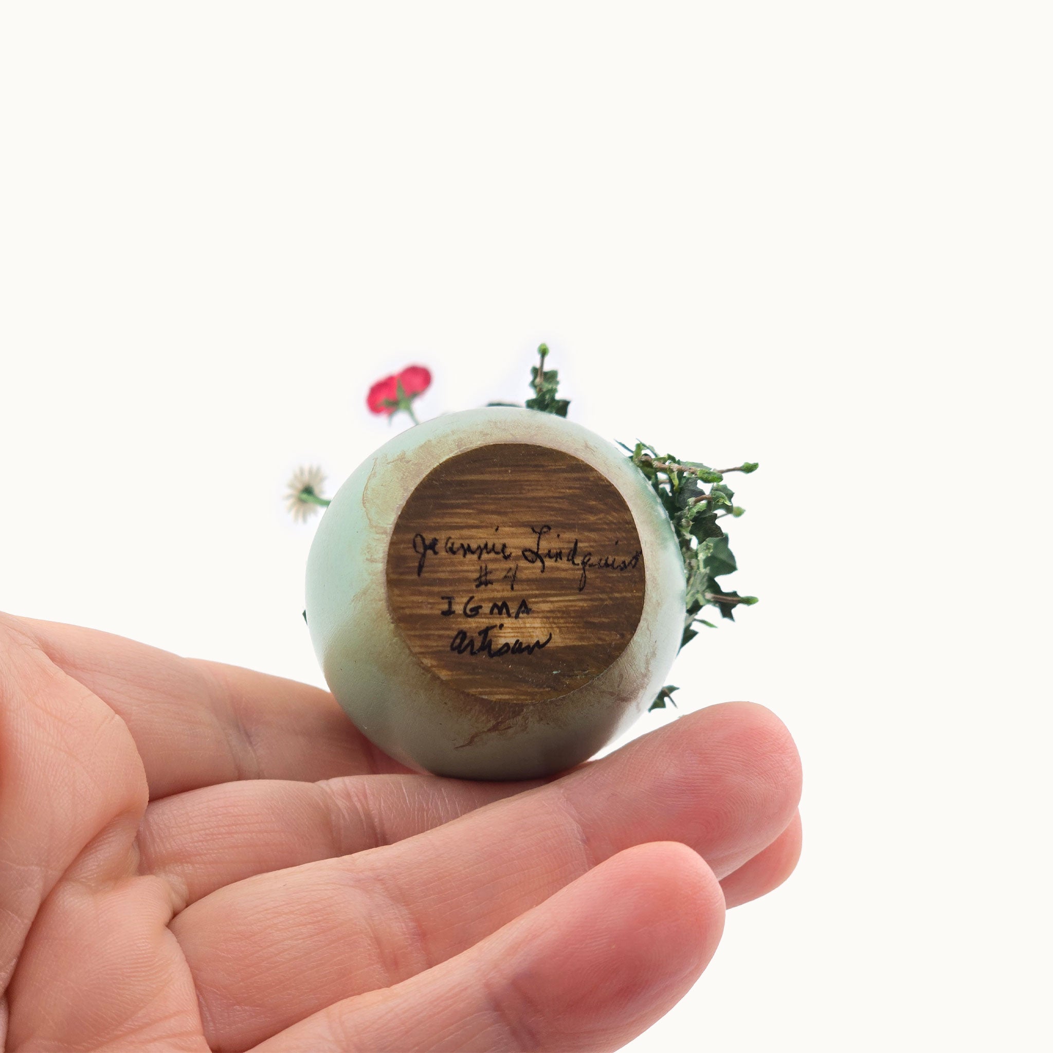 Signed underside of planter by Jeannie Lindquist