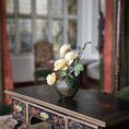 Load image into Gallery viewer, Decorative vase with flowers on a ornate wooden table in a softly blurred room setting
