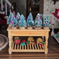 Load image into Gallery viewer, Set of miniature Christmas trees with decorations on a wooden table.
