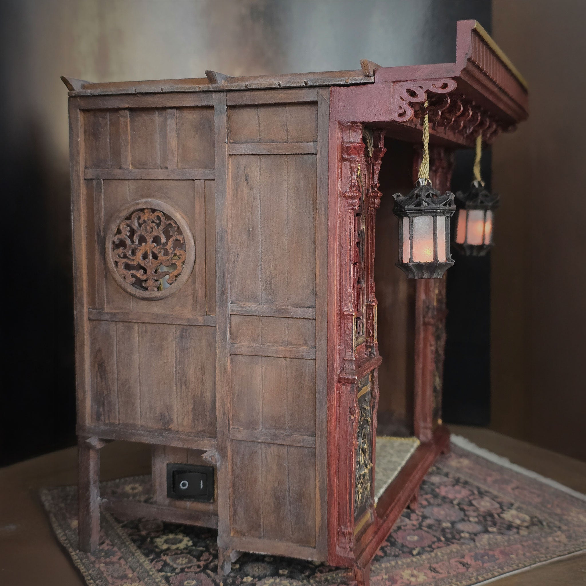 Vintage wooden cabinet with decorative elements on a textured surface