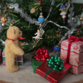 Load image into Gallery viewer, tiny angel tree topper for Christmas being admired by a teddy bear
