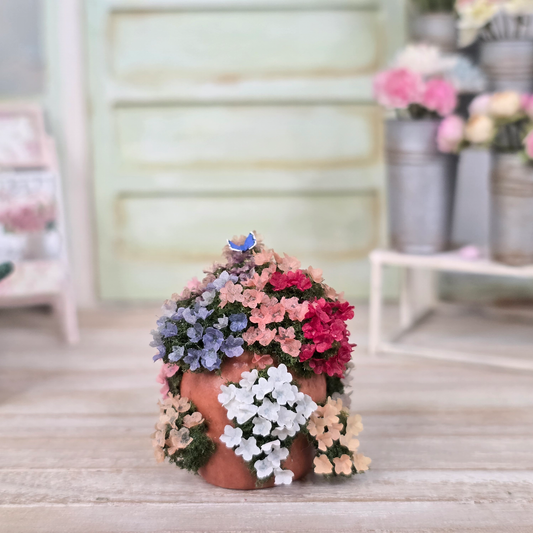 Colorful Flowering Hydrangea Plant in Terracotta Planter with Butterfly Realistic