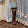Load image into Gallery viewer, Decorative wooden pedestal in a room with ornate blue and white wall paneling.
