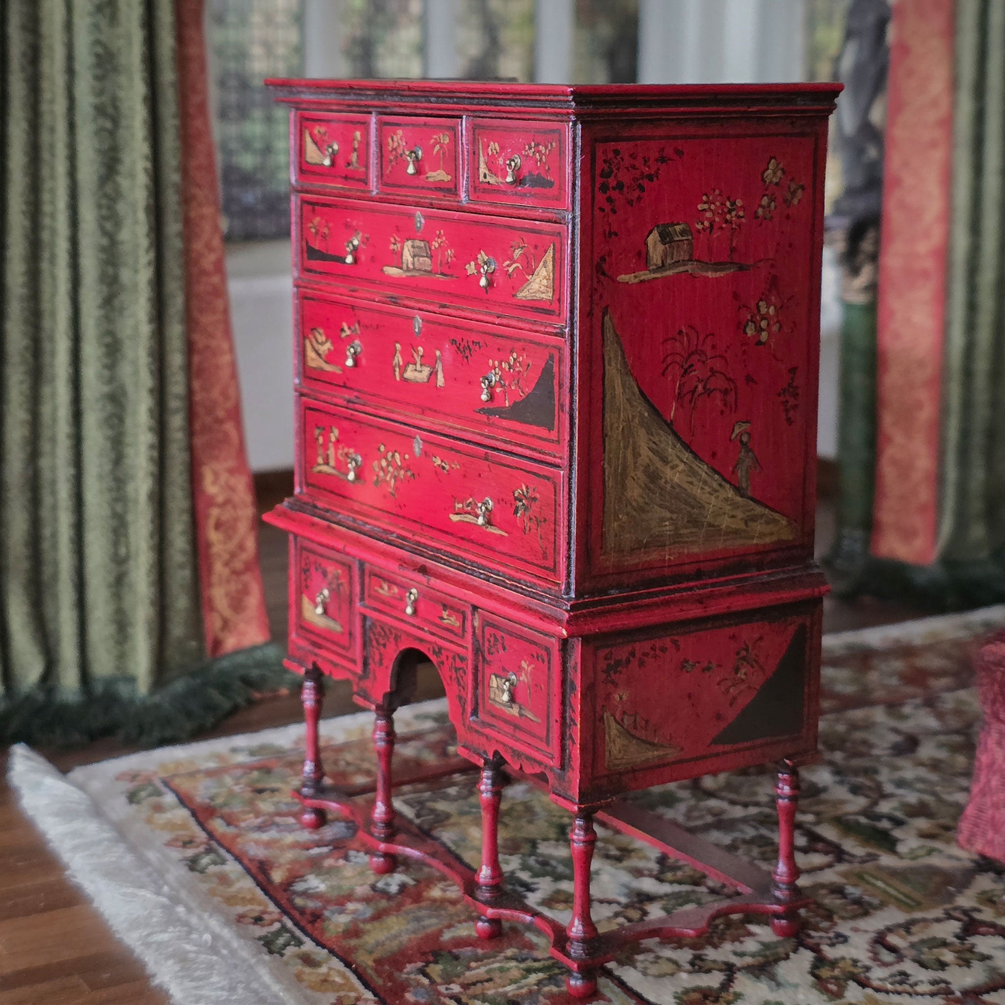 Red vintage cabinet with intricate designs in a room with patterned rug and curtains, Alan Barnes