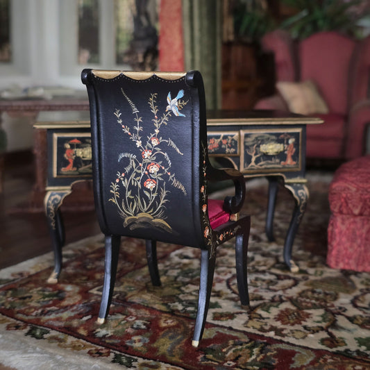Decorative chair with floral patterns in a room with furniture and a rug.