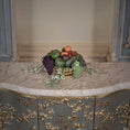 Load image into Gallery viewer, Decorative miniature dollhouse fruit bowl on a marble surface with ornate furniture in the background
