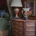 Load image into Gallery viewer, Decorative sculpture with a metal male figure on a black base in a warm, indoor miniature setting.
