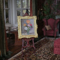 Load image into Gallery viewer, Decorative painting on a stand in an ornate room with furniture and plants.
