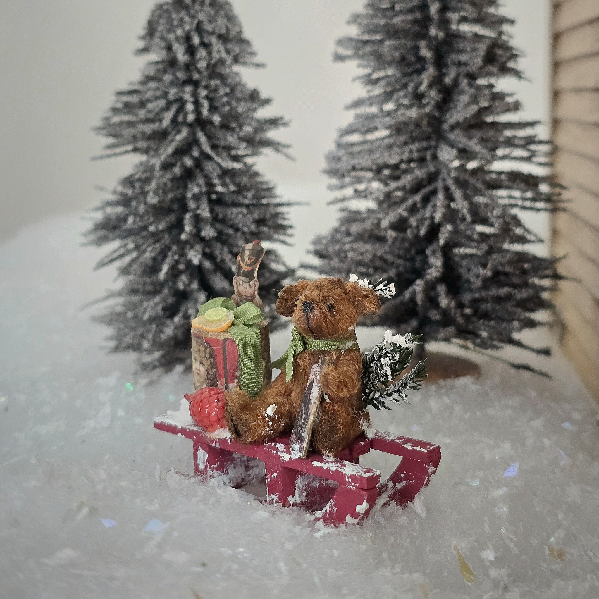 Miniature Snowy Christmas Vignette – Le Coffre D’Emilie, side view with snowy trees in background
