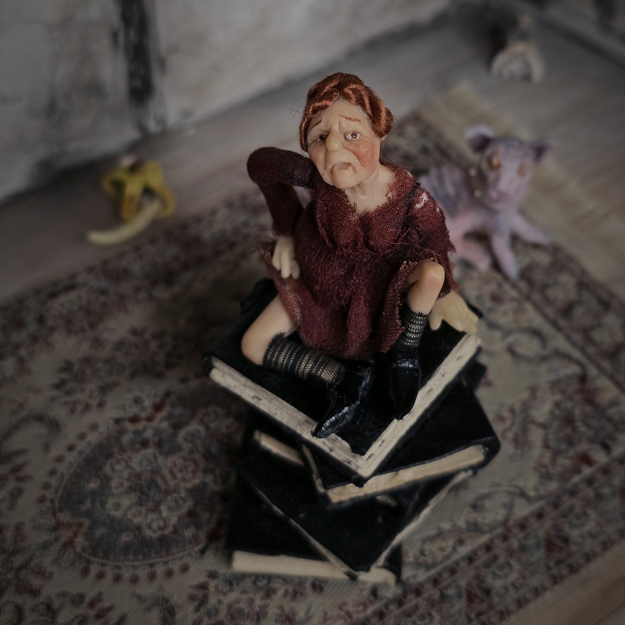 1:24 Scale Older Beggar Woman Clay Figure OOAK Handmade Miniature on Stack of Books