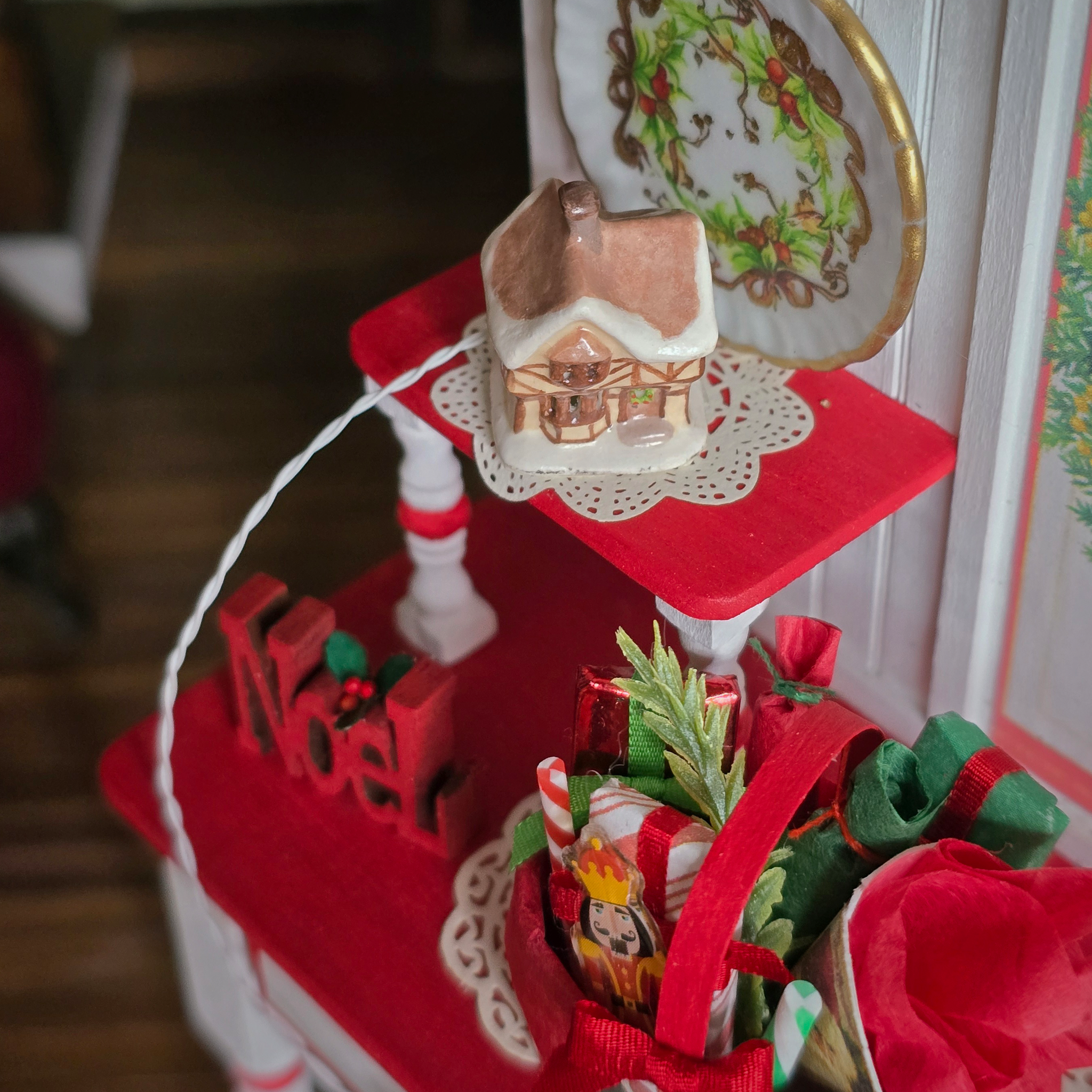 Dollhouse Miniature Light-Up English Cottage, in a festive room