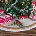 Load image into Gallery viewer, dollhouse miniature Christmas scene with small gifts, a tree, and festive pair of elves' shoes
