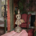Load image into Gallery viewer, Small ornate statue held in a hand with a blurred indoor background
