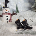 Load image into Gallery viewer, Dollhouse miniature  ice skates with a snowman and snowy background
