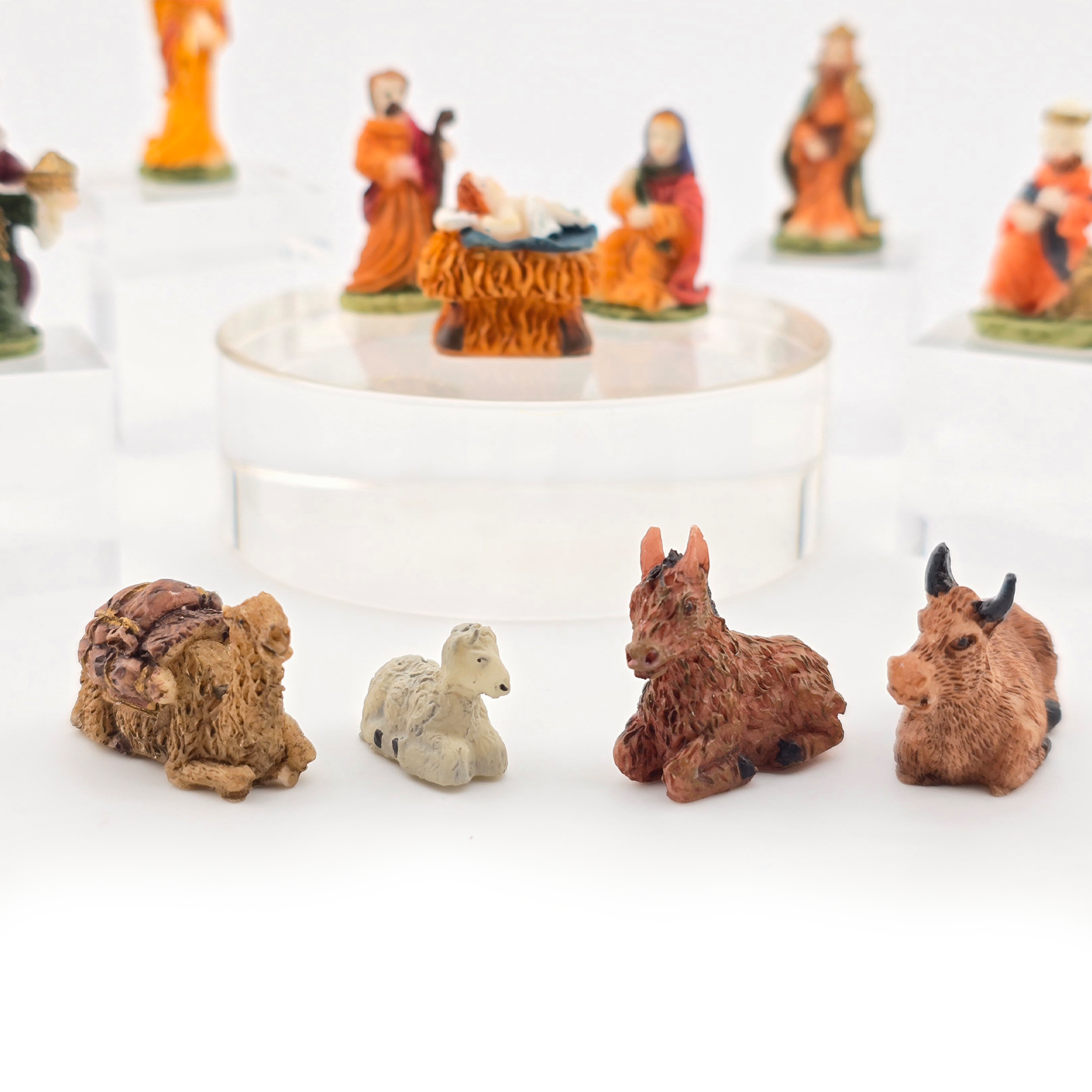 dollhouse Miniature nativity scene figures with animals on a white background