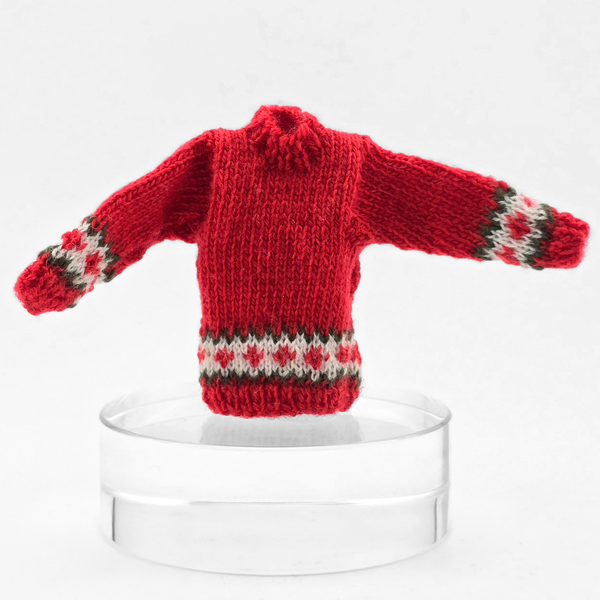 Dollhouse miniature Red knitted sweater with patterned cuffs on a  white background