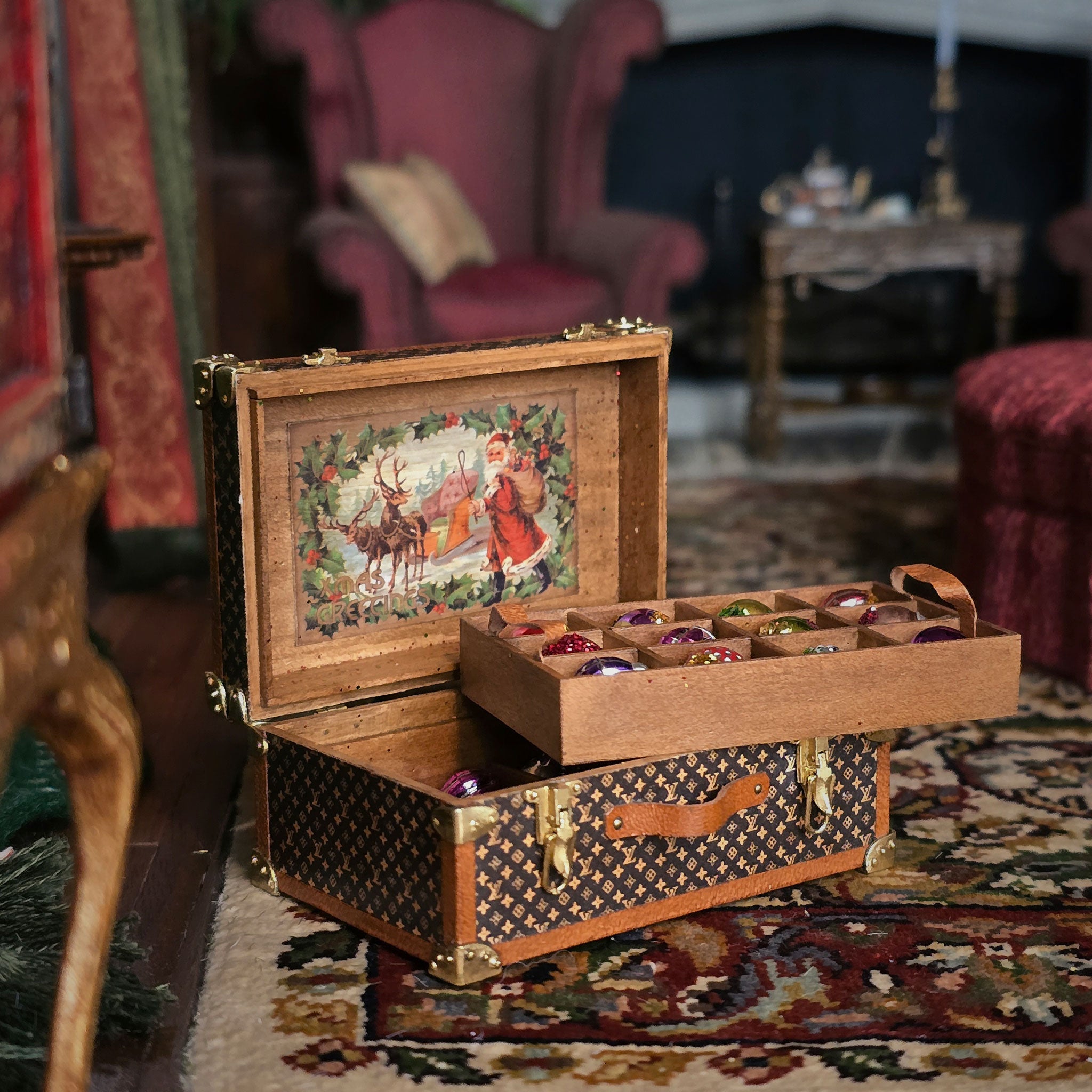 Wooden miniature storage chest box with decorative Christmas lid in a vintage room setting