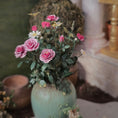 Load image into Gallery viewer, Planter with pink flowers and butterflies on a blurred background
