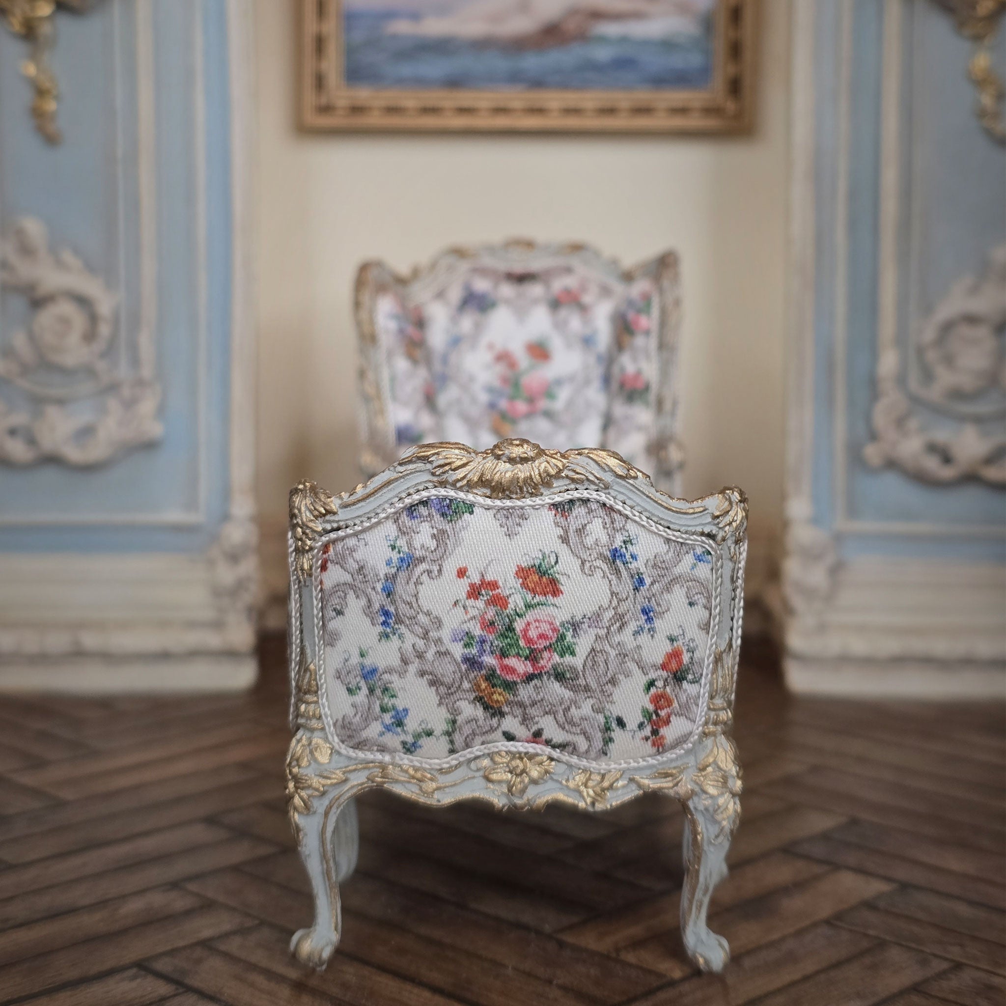 Decorative John J. Hodgson chaise with floral upholstery in a room with ornate walls.