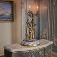 Load image into Gallery viewer, Side view of automata toy sculpture on a marble surface with a blurred background
