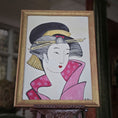 Load image into Gallery viewer, Framed artwork of a traditional Japanese geisha with a pink kimono and black hair, on a wooden easel. Alexandra R.
