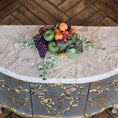 Load image into Gallery viewer, Fruit arrangement on a marble table with a wooden floor background
