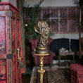 Load image into Gallery viewer, Decorative gold pole with a dog's head in a vintage room setting.
