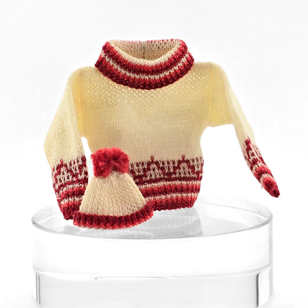 Dollhouse miniature Knitted sweater with red and cream pattern on a white background