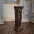 Load image into Gallery viewer, Wooden pedestal in a room with decorative walls and a painting, side view
