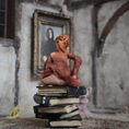 Load image into Gallery viewer, 1:24 Scale Older Beggar Woman Clay Figure OOAK Handmade Miniature on Stack of Books
