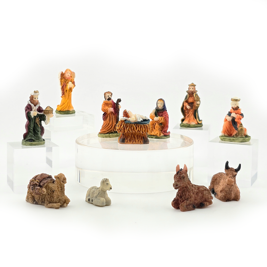Set of miniature dollhouse nativity scene figurines on a white background