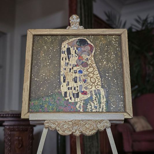 Framed painted art of 'The Kiss' by Gustav Klimt on an easel by Sam Kelm