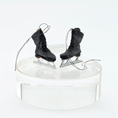 Load image into Gallery viewer, Dollhouse miniature Pair of black ice skates on a white background
