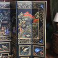 Load image into Gallery viewer, Decorative book with intricate designs of landscapes and figures on a room divider.
