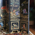 Load image into Gallery viewer, Decorative folding screen with intricate scenes and patterns on a wooden floor screen.
