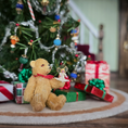 Load image into Gallery viewer, tiny angel tree topper for Christmas  on the paw of a toy teddy bear
