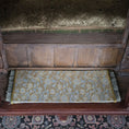 Load image into Gallery viewer, Decorative silk rug with intricate patterns on a wooden bench of alcove bed
