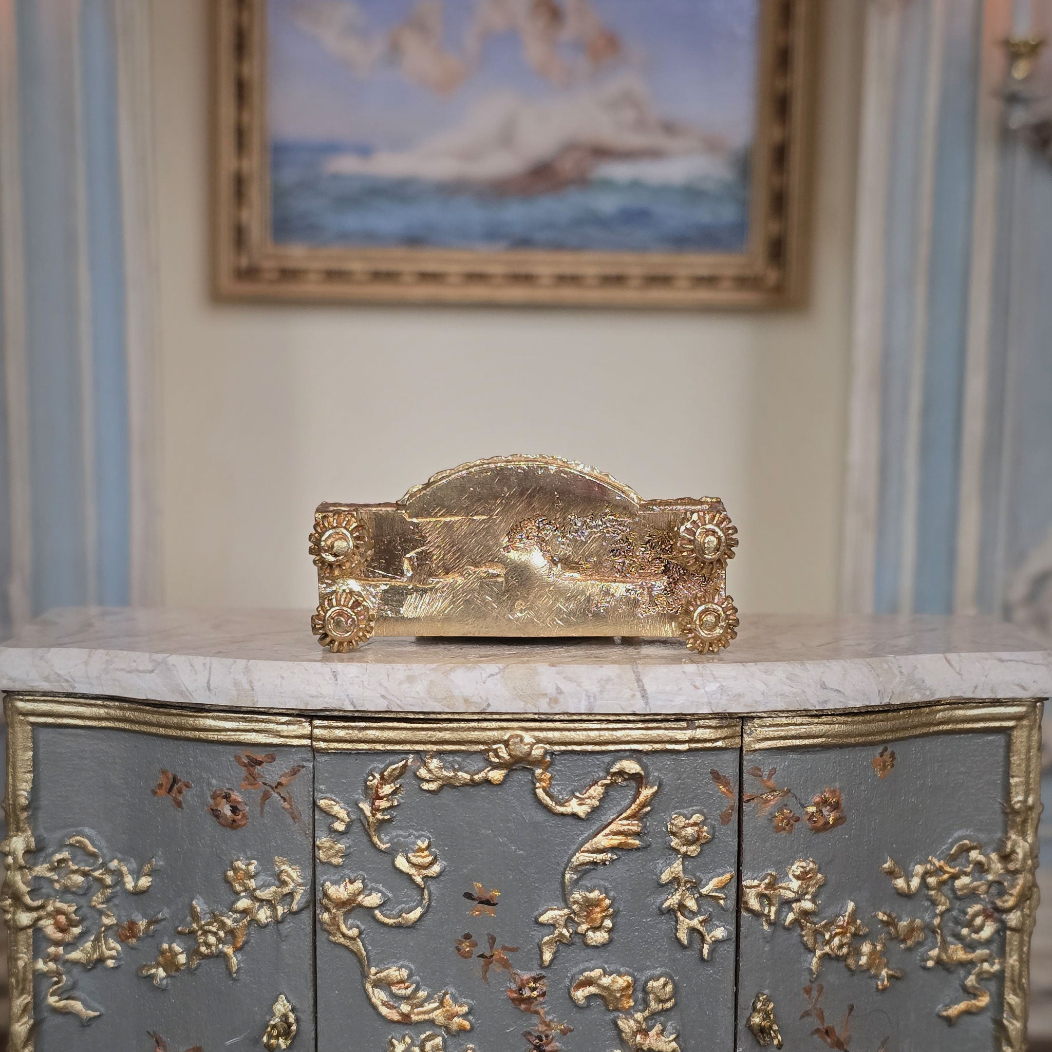 Underside with gold gilt details of the miniature dollhouse mantle clock