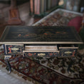 Load image into Gallery viewer, Decorative wooden hand painted desk with intricate carvings on a patterned rug
