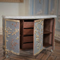 Load image into Gallery viewer, Decorative wooden cabinet with marble top on a wooden floor and open doors
